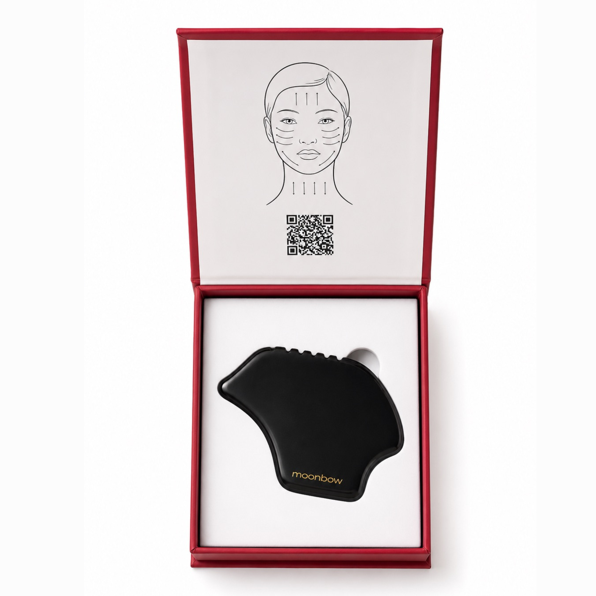 A black facial massage tool by moonbow, presented inside an open red gift box with a white insert showing a face diagram and QR code.